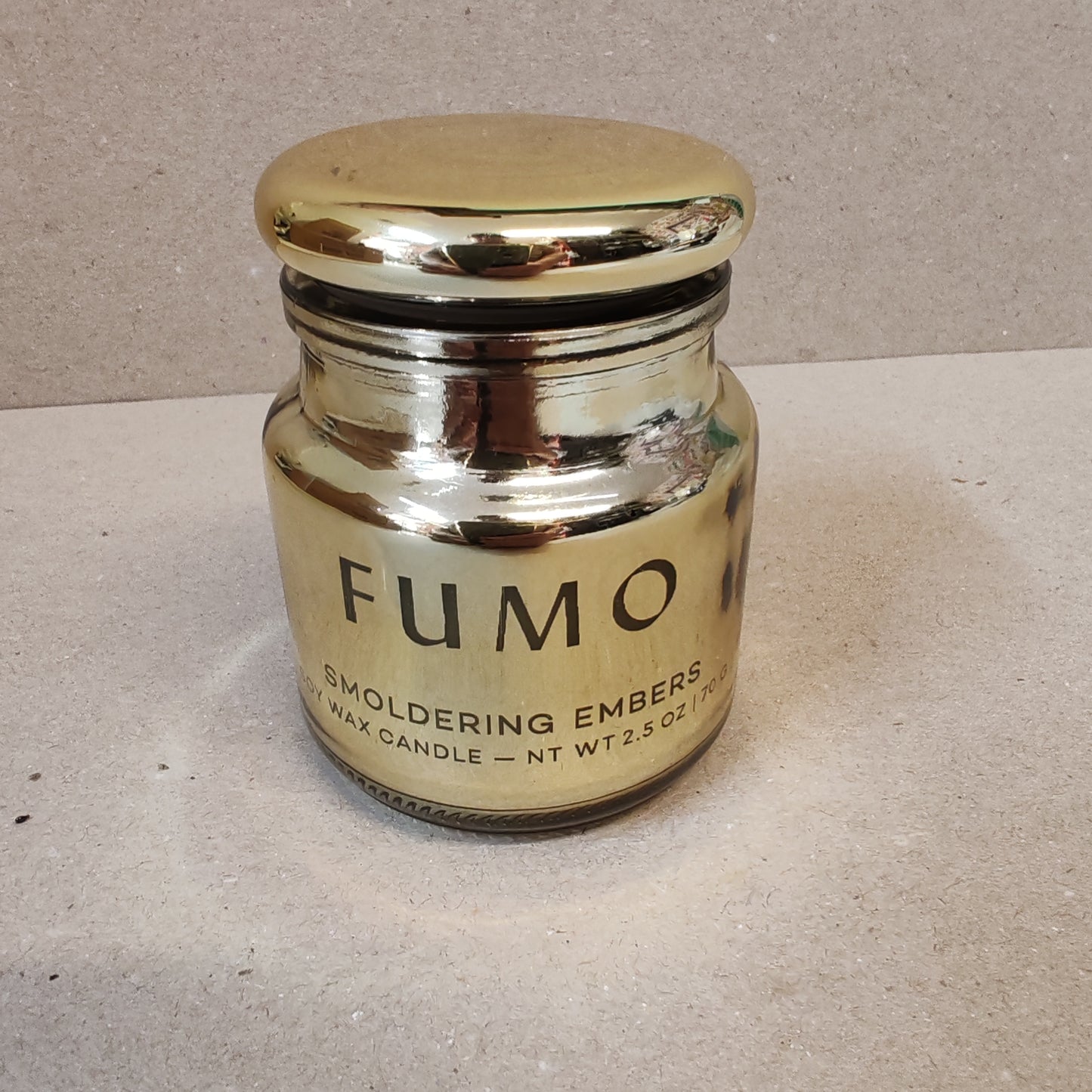 Chrome 2.5oz scented candle in gold metallic glass container . Scent of Smoldering embers.