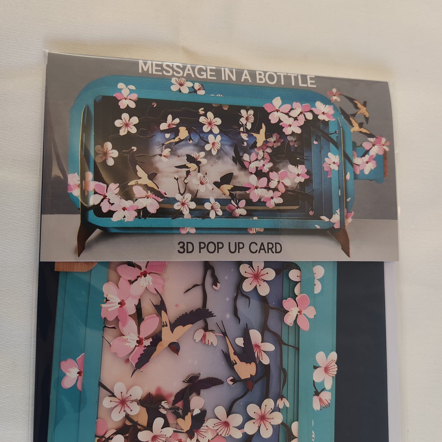 Message in a bottle 3d pop up greeting card. Cherry blossom theme.