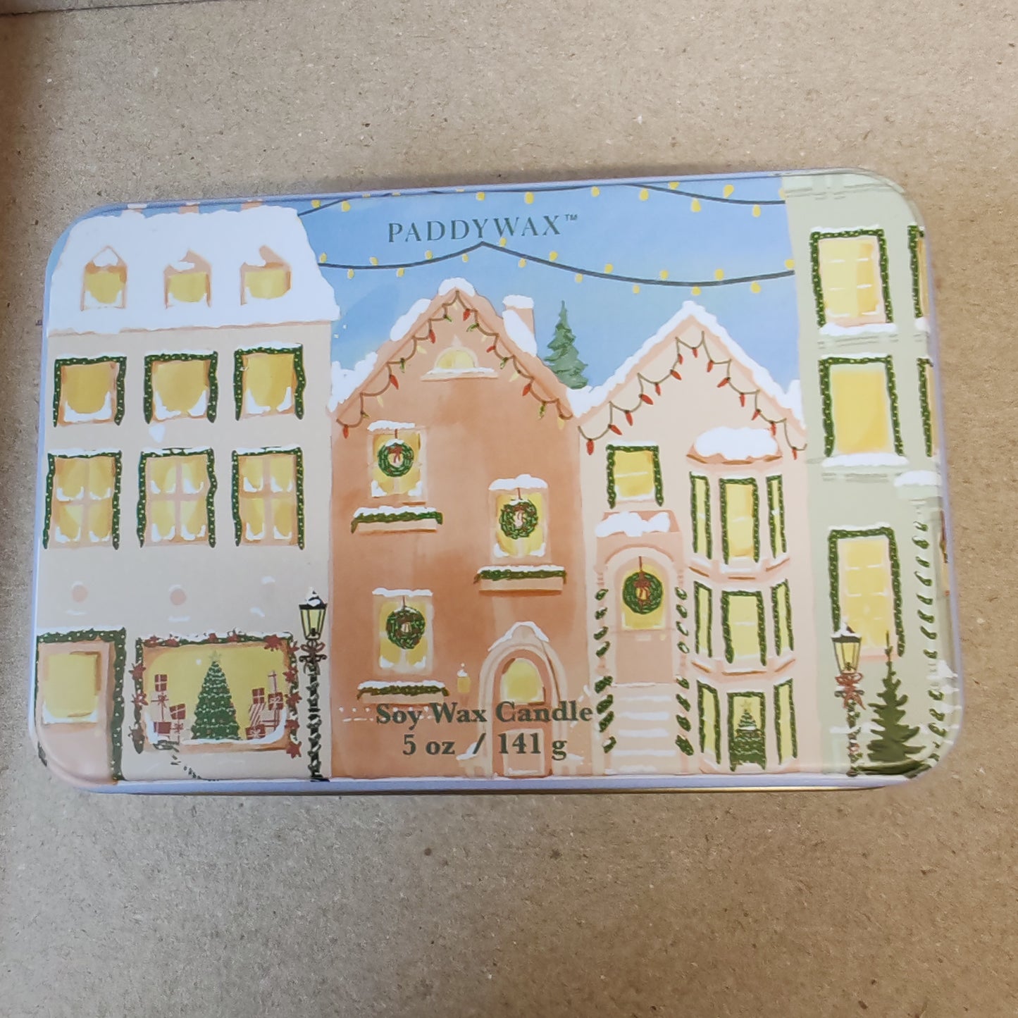 5oz printed tin scene of Christmas village. Scent of Gingerbread