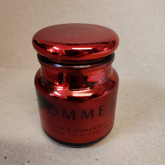 Scented candle in a red chrome glass jar. Scent of red apple and pomander.
