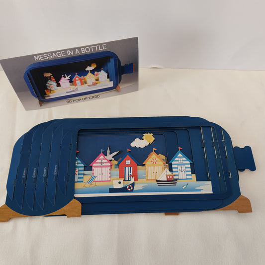 Message in a bottle pop up greeting card with beach hut scene