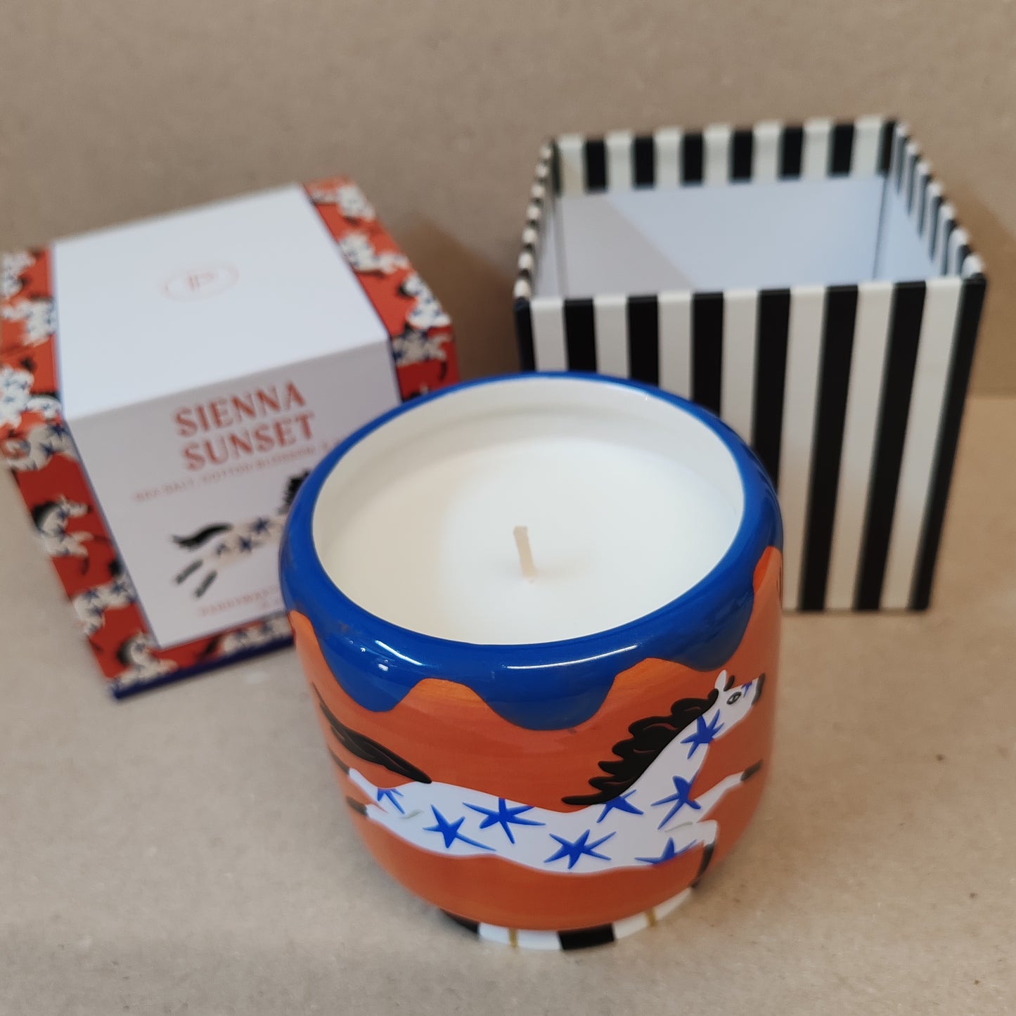 Adopo scented candle with horse design. Sienna sunset Scented