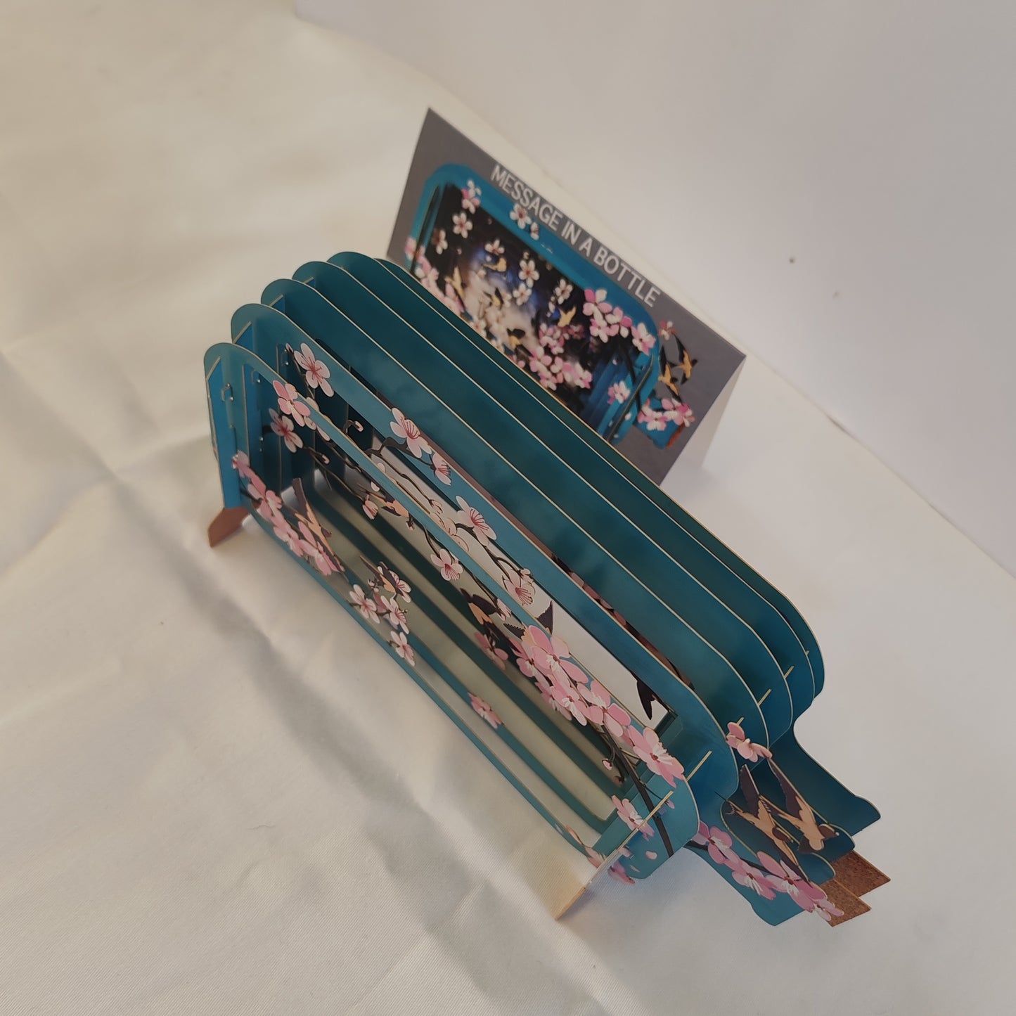 Message in a bottle 3d pop up greeting card. Cherry blossom theme.