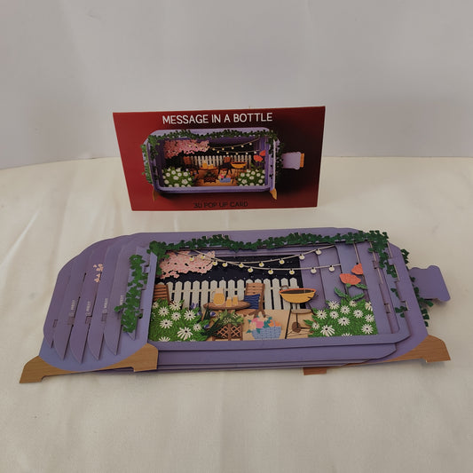 Message in a bottle pop up greeting card garden scene