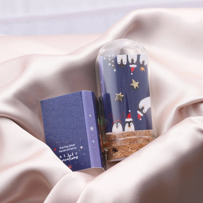 Gold Star Earrings with penguin graphic