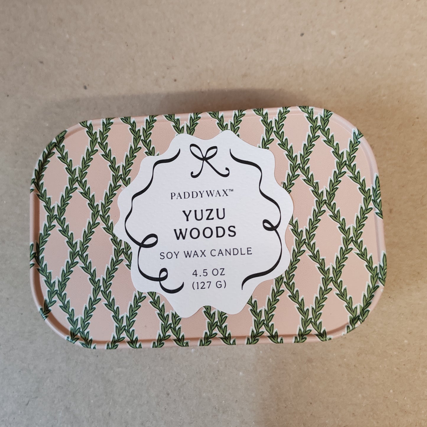 Cherie 4.5oz scented candle in printed tin. Yuzu woods