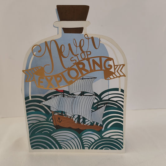 Never stop exploring pierced out greeting card. Ship in a bottle design