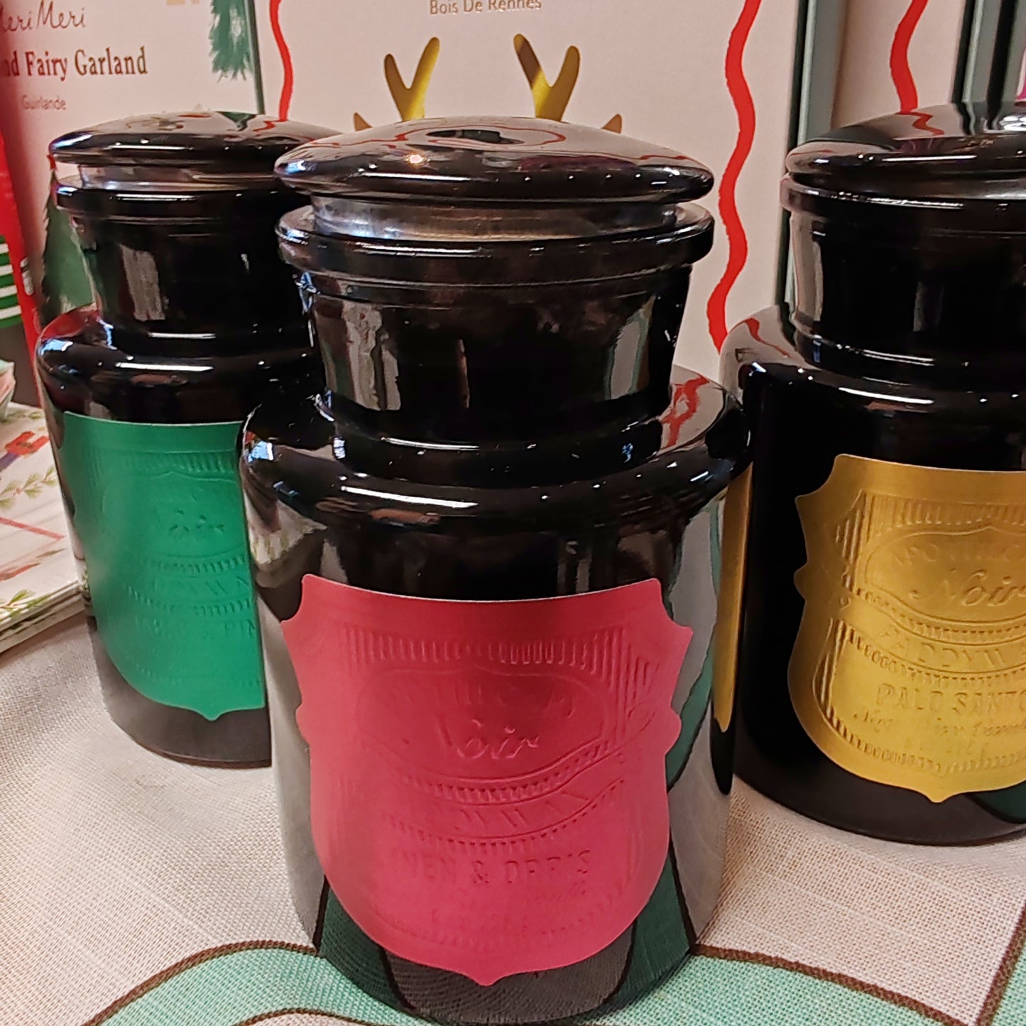 Black Apothecary Jar gold label. Scent of Palo Santo