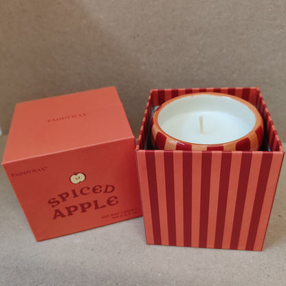 6.5oz scented candle in red and coral stripe ceramic pot. Tangerine and clove