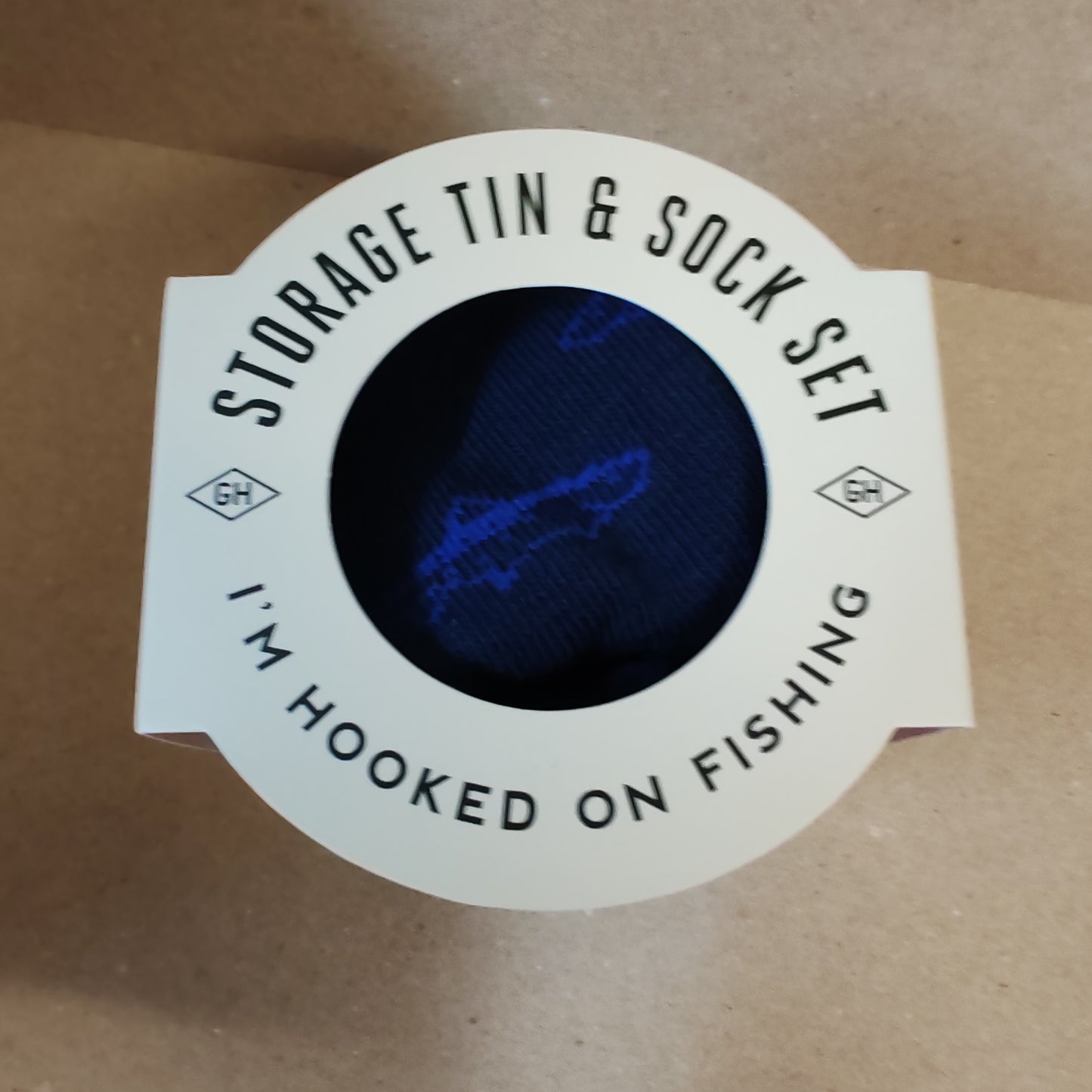 Fishing theme socks in a usable tin container.