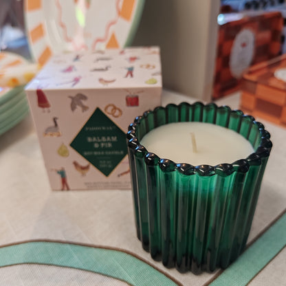 Festive fir and balsalm scented candle in a green glass votive. Exquisite packaging