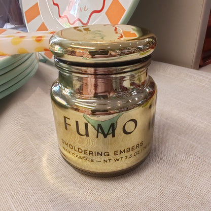 Chrome 2.5oz scented candle in gold metallic glass container . Scent of Smoldering embers.