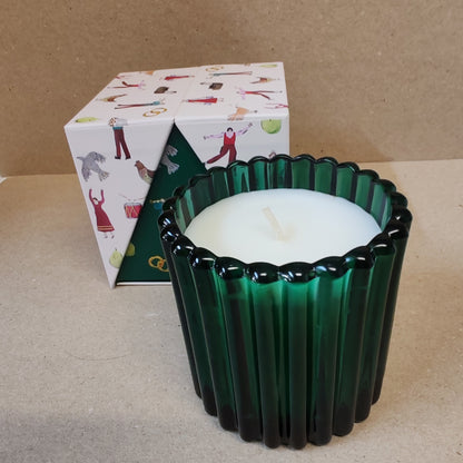 Festive fir and balsalm scented candle in a green glass votive. Exquisite packaging