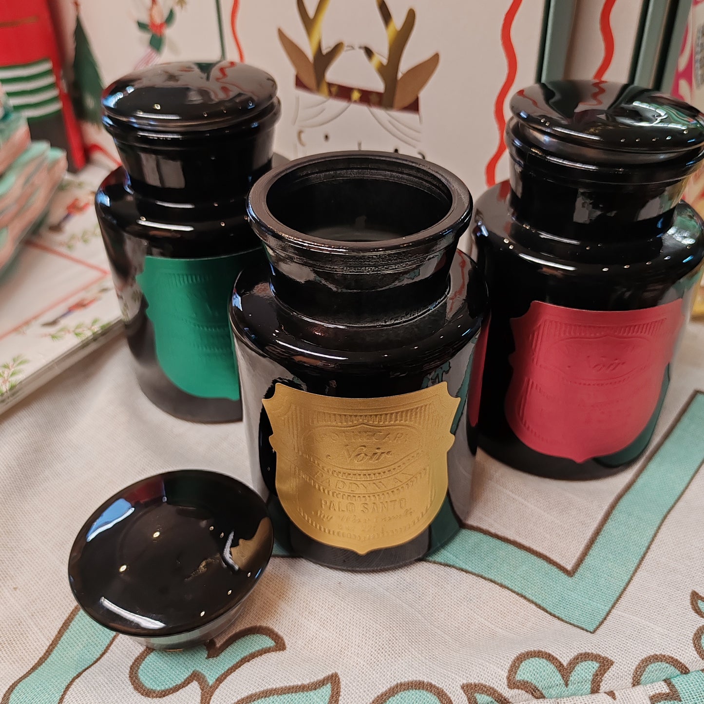 Black Apothecary Jar gold label. Scent of Palo Santo