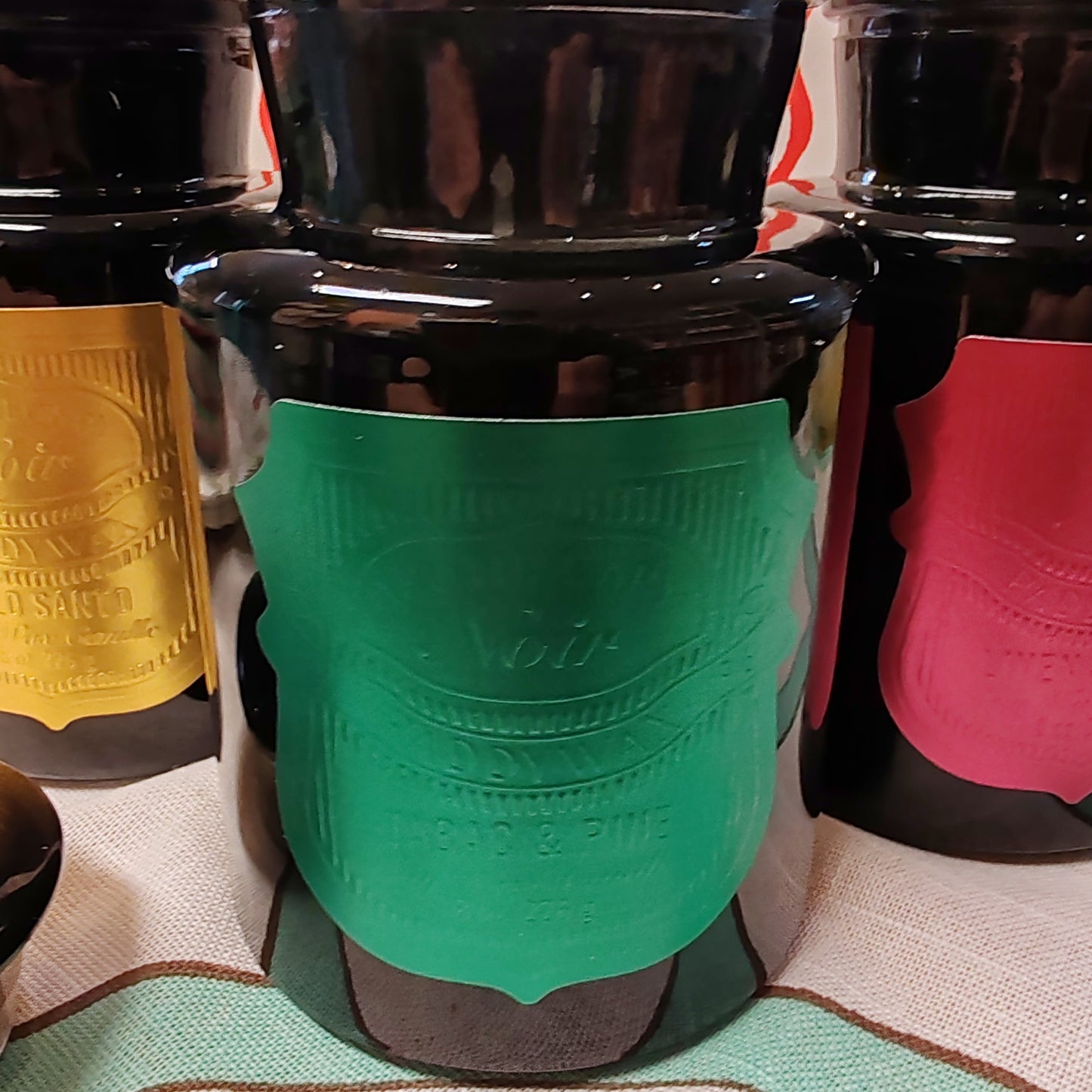 Black Apothecary Jar green foil label. Scent of Tabac and Pine