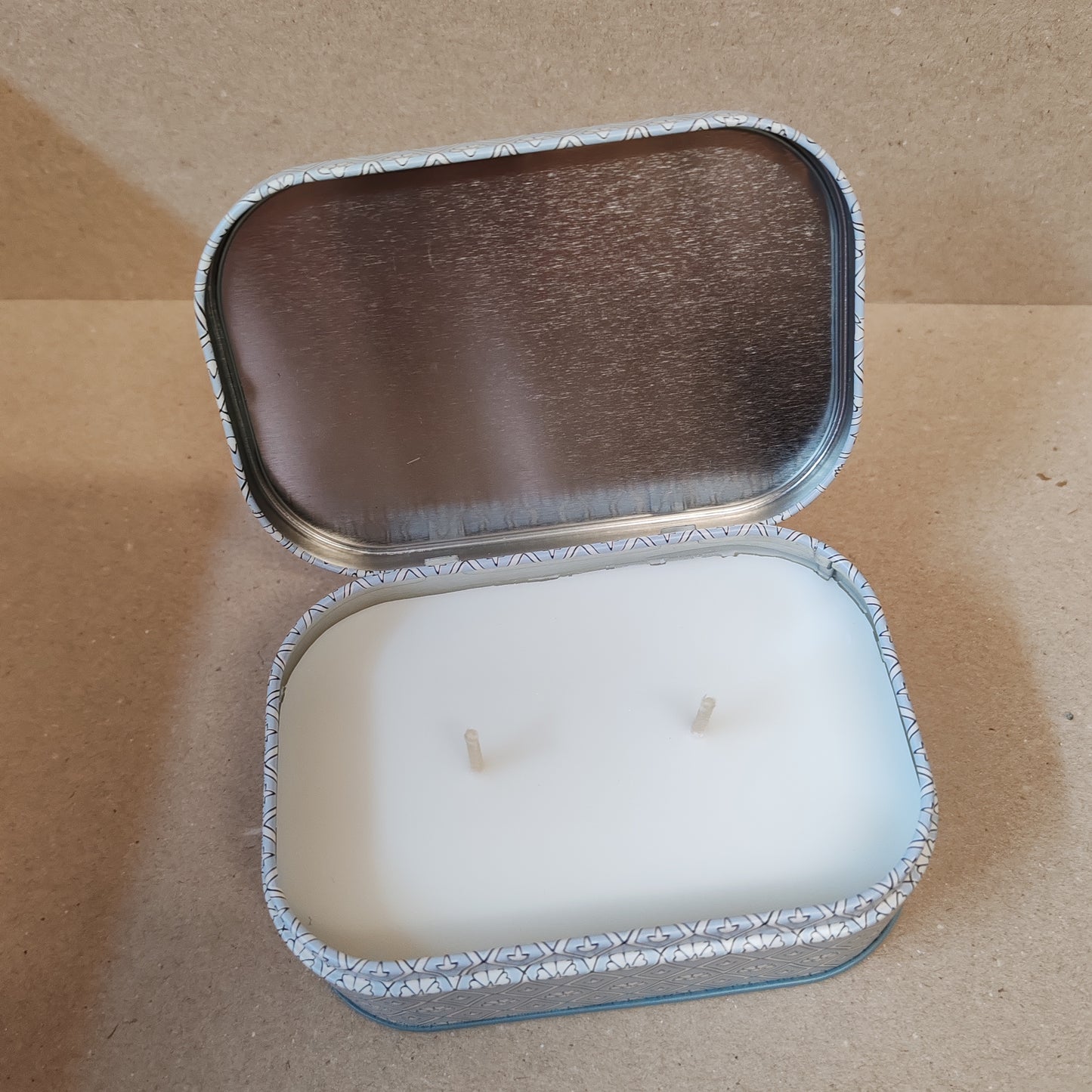 Scented 4.5oz scented candle in printed blue and white tin. Scent of lavender and thyme.