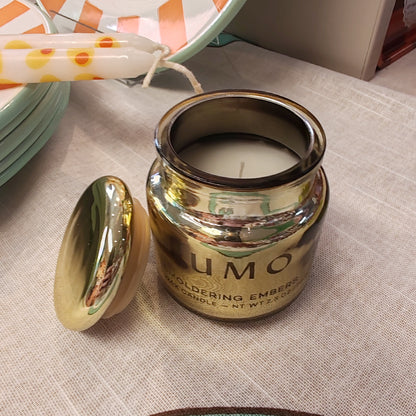 Chrome 2.5oz scented candle in gold metallic glass container . Scent of Smoldering embers.