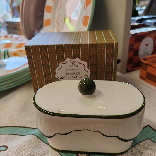 Cherie 5.5oz scented candle in porcelain lides pot with drawer packaging. Scent of Smoked Pistachio.