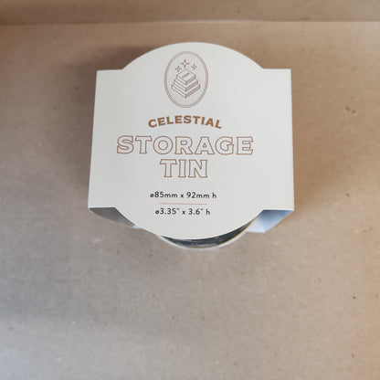 Celestial storage tin decorated with moon faces.