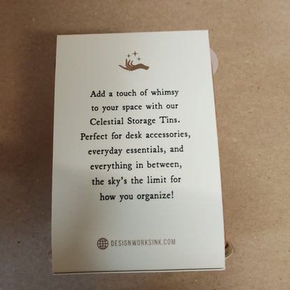 Celestial storage tin decorated with the sun faces.