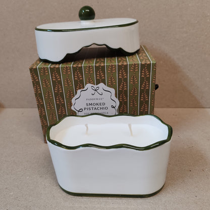 Cherie 5.5oz scented candle in porcelain lides pot with drawer packaging. Scent of Smoked Pistachio.