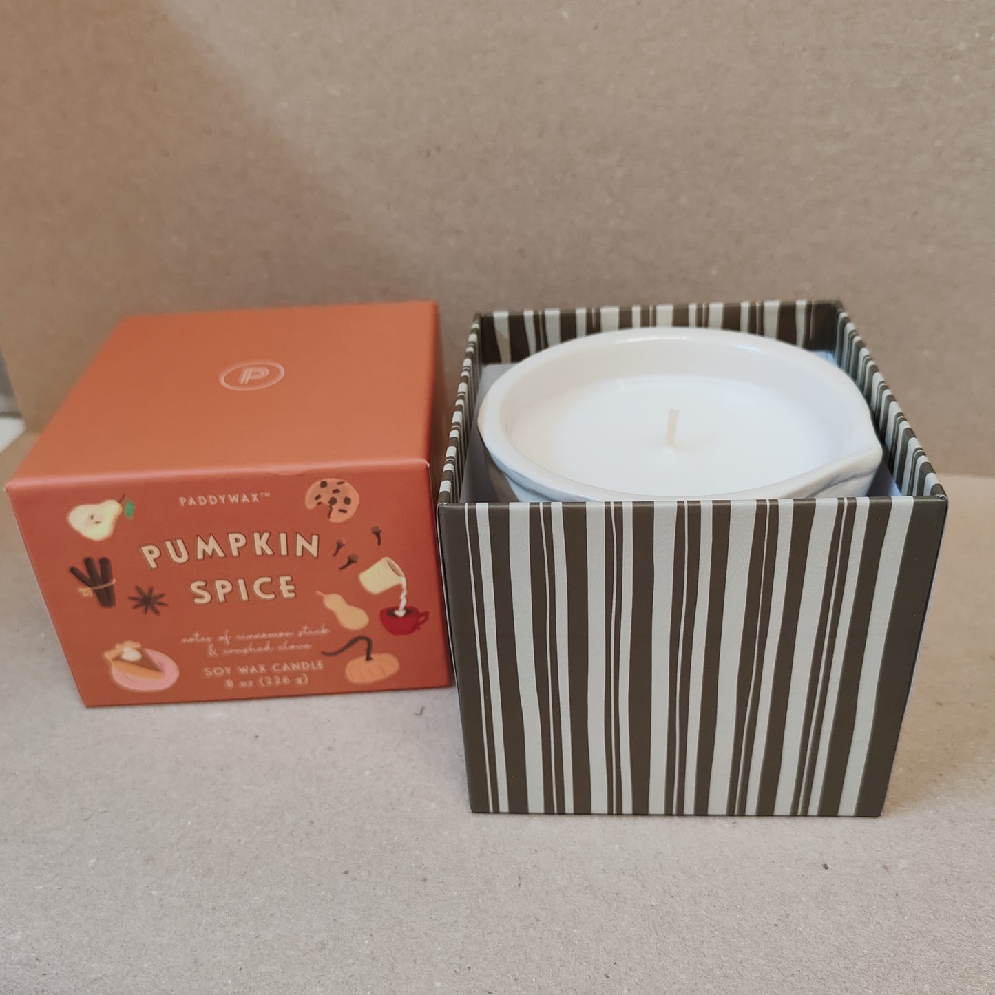 Bistro 8oz pumpkin scented candle in a ceramic pot.