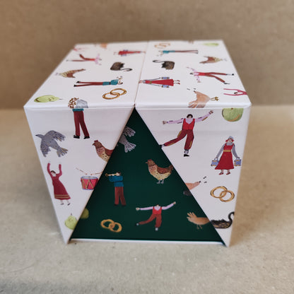 Festive fir and balsalm scented candle in a green glass votive. Exquisite packaging