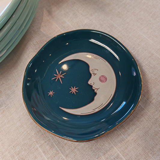 Celestial Trinket dish decorated with teal moon .