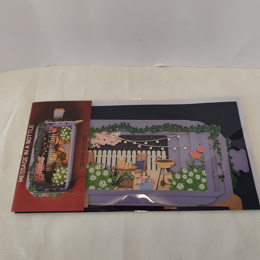 Message in a bottle pop up greeting card garden scene