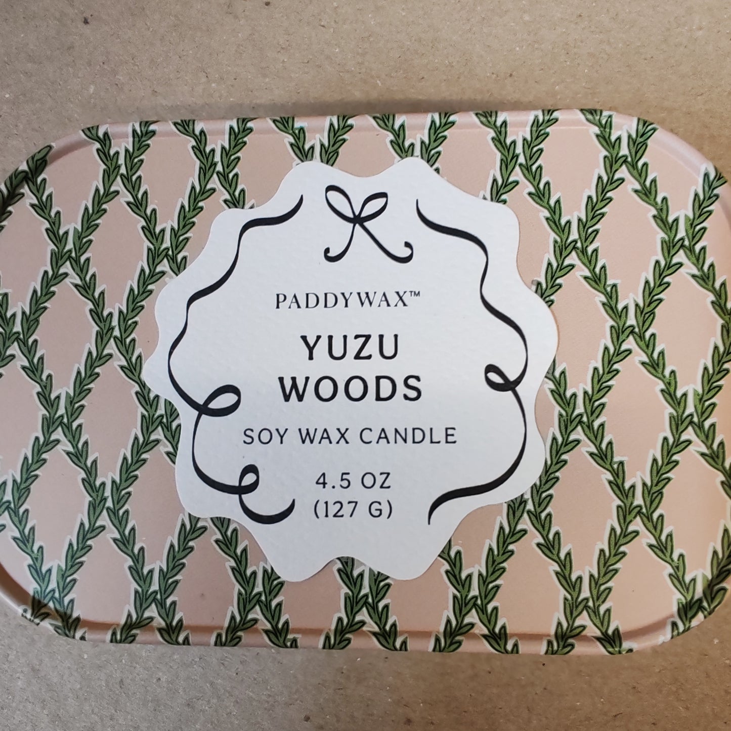 Cherie 4.5oz scented candle in printed tin. Yuzu woods