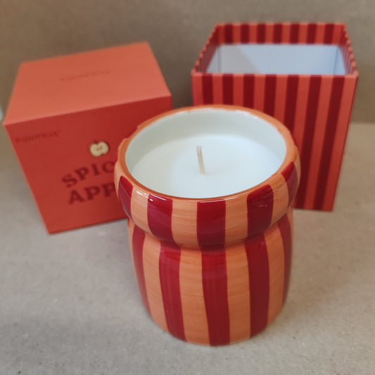 6.5oz scented candle in red and coral stripe ceramic pot. Tangerine and clove