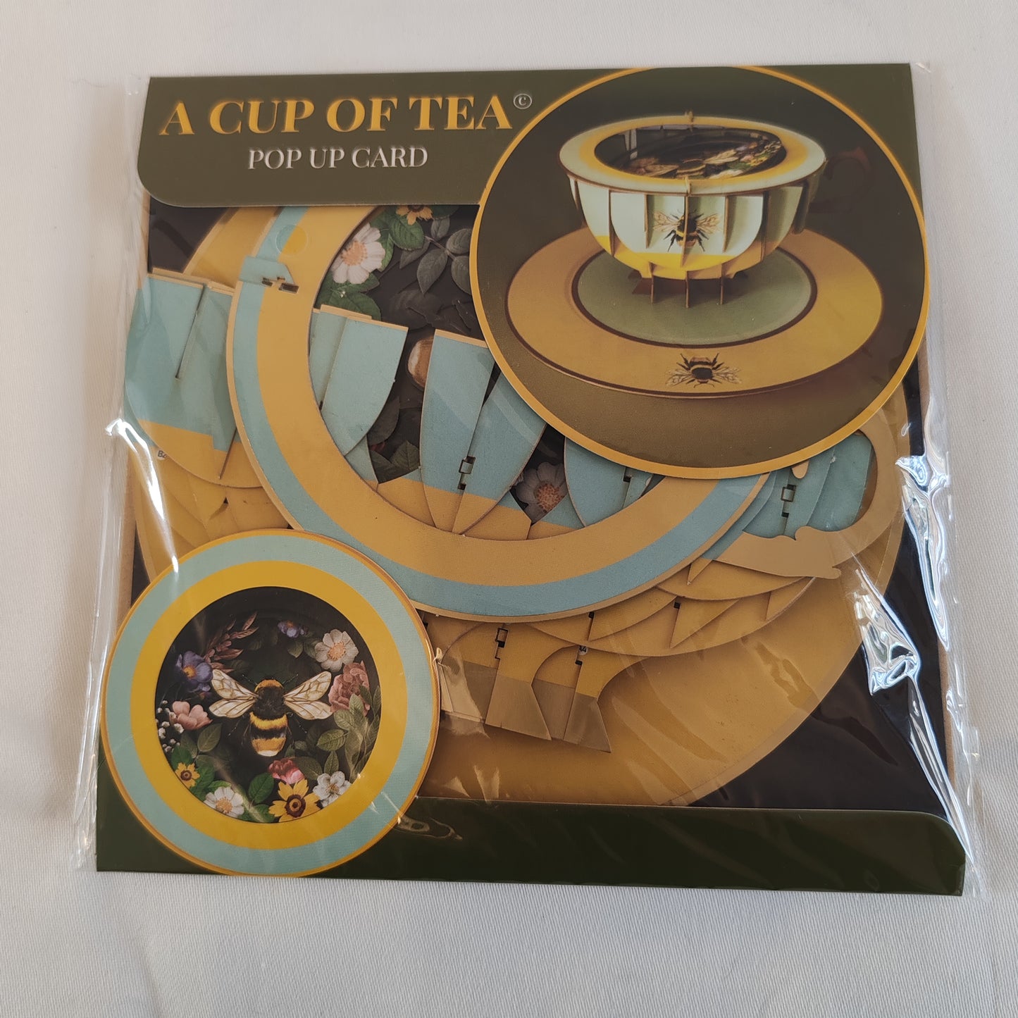 Cup of tea pop up greeting card. Bee theme