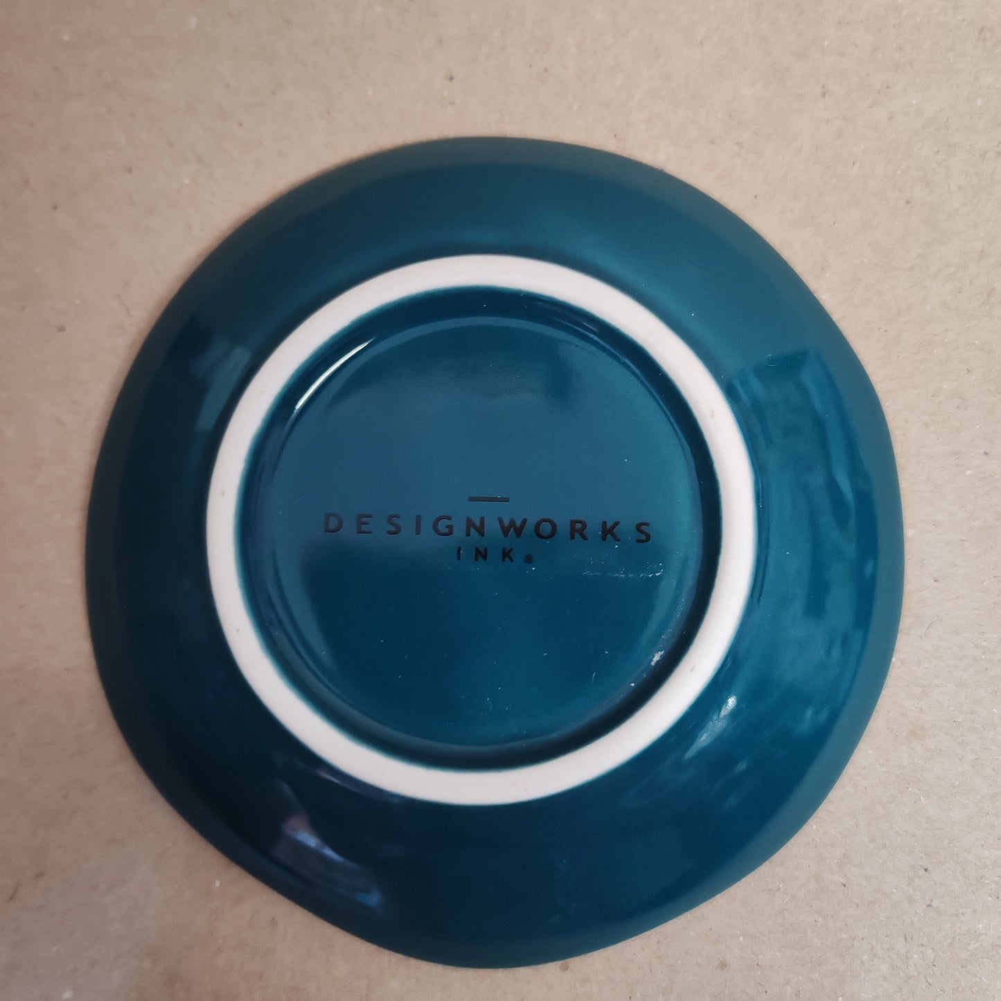 Celestial Trinket dish decorated with teal moon .