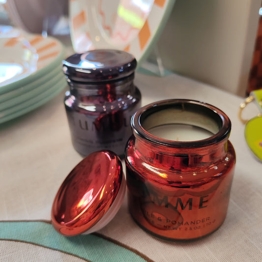 Scented candle in a red chrome glass jar. Scent of red apple and pomander.