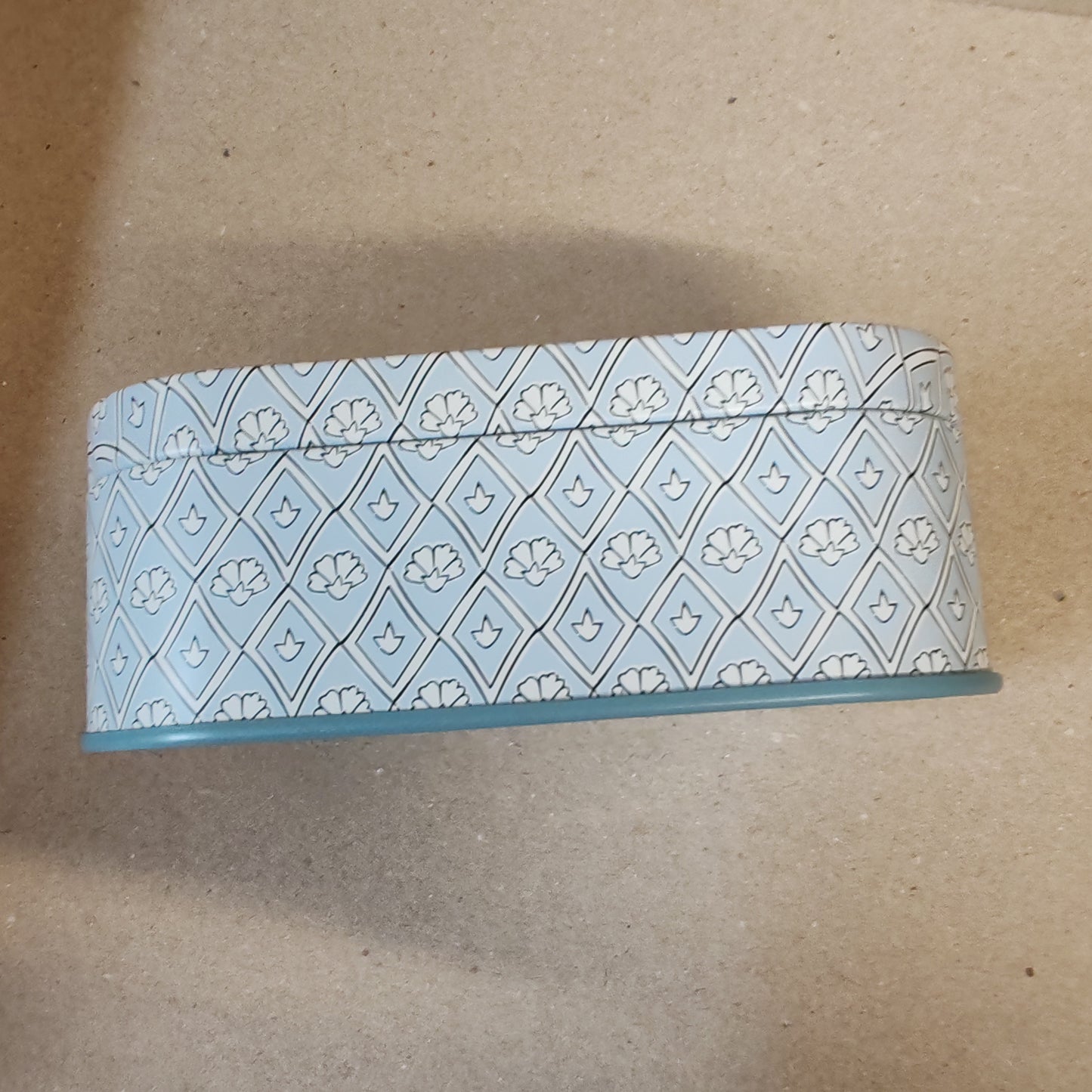Scented 4.5oz scented candle in printed blue and white tin. Scent of lavender and thyme.